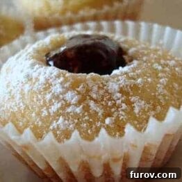 Ruby Jewel Cookies, top-down view in muffin liners with jam filling.