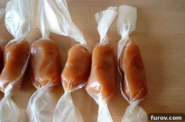 My Mom's Famous Caramels 2 Caramels wrapped in wrappers lined up in a row, glistening with homemade perfection.