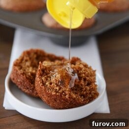 A perfectly baked Whole Grain Honey Bran Muffin, showcasing its golden-brown top and wholesome texture.