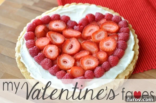 Sweet Valentine Selections 2 A festive table display featuring a variety of pink and red Valentine's Day treats, including heart-shaped cookies and candies, for a loving celebration.