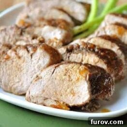 A smaller, appetizing image of thick slices of pork loin featuring the rich brown sugar glaze and spice rub.