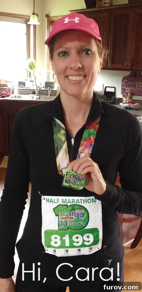 Jessica's Tribute to Cara: A Story of Heartbreak and Triumph 2 A woman in running gear, possibly Cara, smiling after a race.