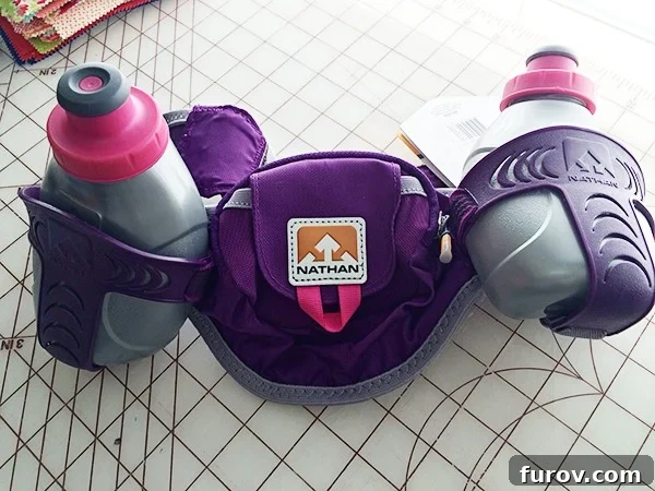 A new running hydration pack with two water bottles, symbolizing commitment to longer runs and increased stamina.
