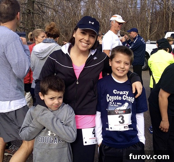 The Chronicle of Mel 2 A woman standing proudly with her two sons after a run, embodying the spirit of family and fitness.