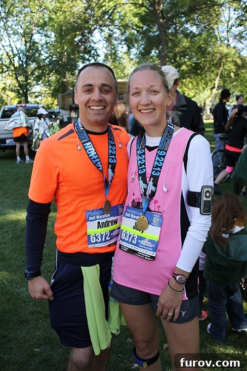 The Unwritten Story of Judith 3 Two runners embracing after crossing the finish line of a half marathon, showing joy and accomplishment.