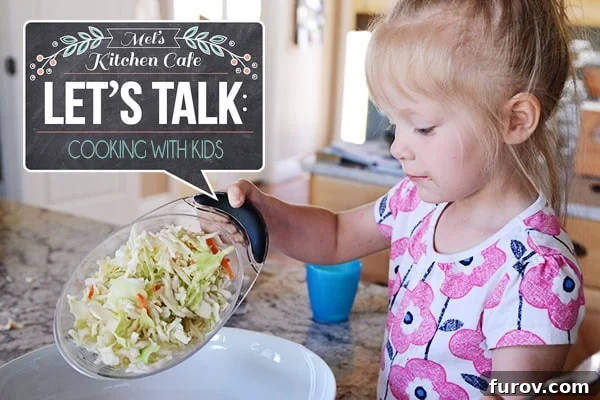 A little girl pouring salad into a white platter.