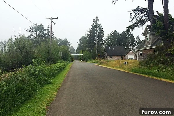 Runner enjoying a misty, humid run along the beautiful Oregon coast, with the ocean in the background.