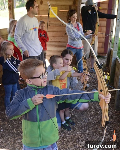 Candid shot of a person practicing archery during a family reunion, showcasing active leisure.