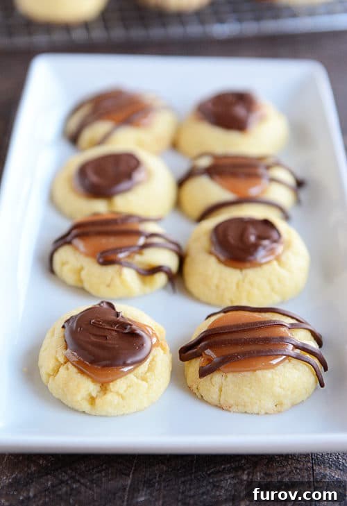 Caramel Chocolate Shortbread Delights 4 A white platter of caramel and chocolate covered shortbread cookies.