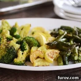 A vibrant mix of roasted vegetables, perfectly golden and seasoned.