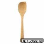 A wooden spoon, ideal for stirring hot milk.