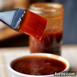 The Secret to Irresistible Homemade Barbecue Sauce 6 A delicious homemade barbecue sauce in a jar.