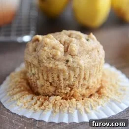 A whole grain peanut butter and honey banana muffin, golden brown and perfectly baked.