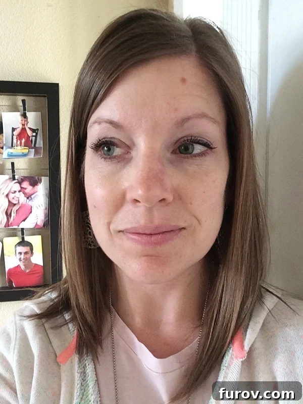My Face's Transformation A Personal Account 10 A current headshot of a smiling brown-haired woman, showing excellent healing with a minimal, faint scar on her nose.