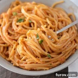 A bowl of fresh tomato pesto pasta