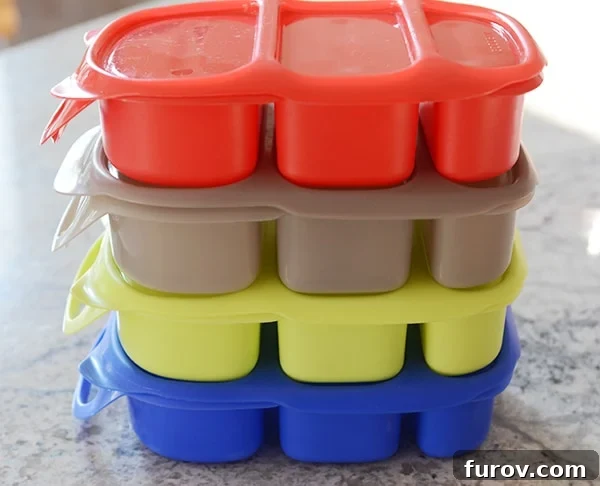 Taming the Back to School Bedlam 4 Four brightly colored bento lunchboxes stacked neatly.