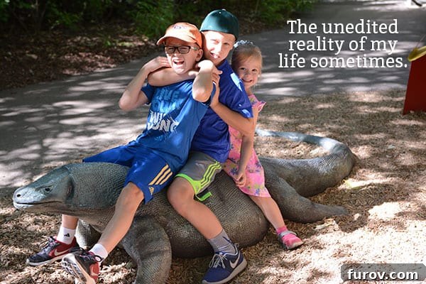 Taming the Back to School Bedlam 7 Three children playfully sitting on a large stone lizard sculpture.
