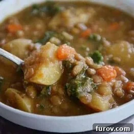 A small bowl of Smoky Lentil and Potato Soup, representing the delicious recipe within.