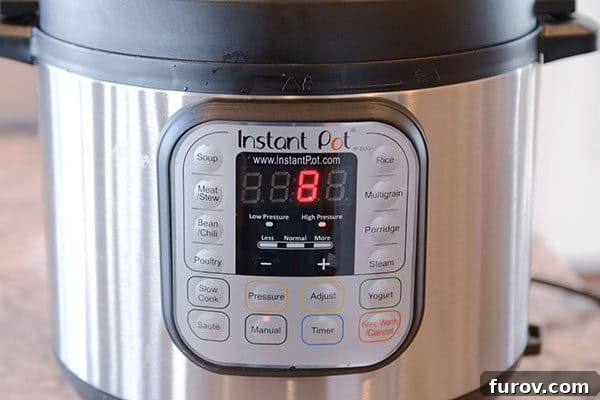 The front of an Instant Pot with 8 minutes left on the timer. 