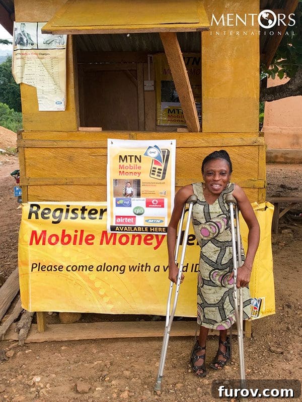 Ghana: One Year On - Our Journey's Impact, Your Unseen Hand 4 Naomi, a microloan recipient in Ghana, smiling broadly with new hope.