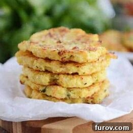 Close-up of baked spaghetti squash fritters, showing their golden crust and tender texture.