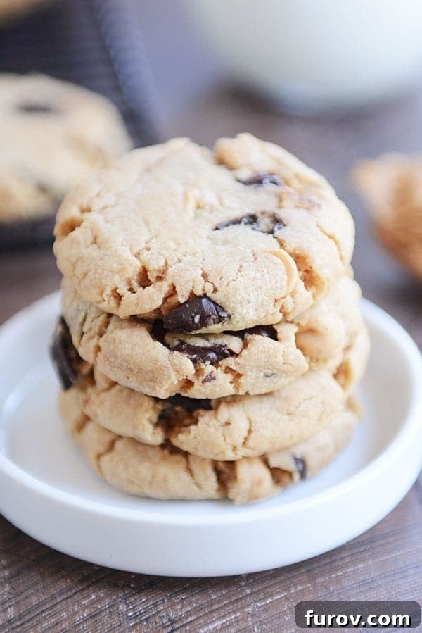 Velvety Soft Egg Free Peanut Butter Chocolate Chip Cookies 2 A stack of chocolate chip peanut butter cookies in a white ramekin.