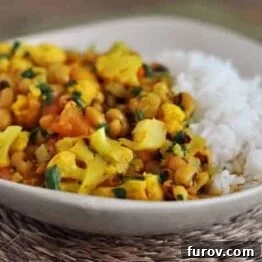 A bowl of vibrant Bean Curry with fresh herbs.