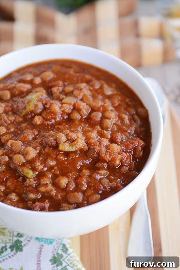 Instant Pot Lentil Chili Stovetop and Slow Cooker Variations 4 Top view of a white bowl full of lentil beef chili.