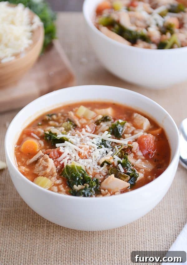 Turkey & Chicken Brown Rice Soup: Pressure Cooker & Stove Top Ready 2 A white bowl full of turkey, vegetable, and brown rice soup topped with parmesan cheese.