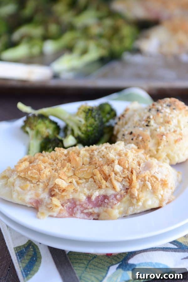 One-Pan Cordon Bleu Chicken & Broccoli Roast 5 A complete plate of unstuffed sheet pan chicken cordon bleu, served with a generous portion of roasted broccoli and a flaky buttermilk biscuit.