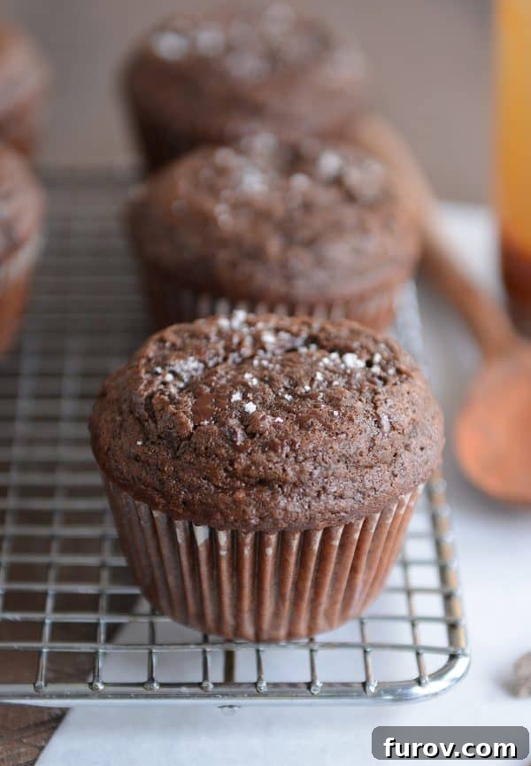 Double chocolate salted caramel muffin on cooling rack