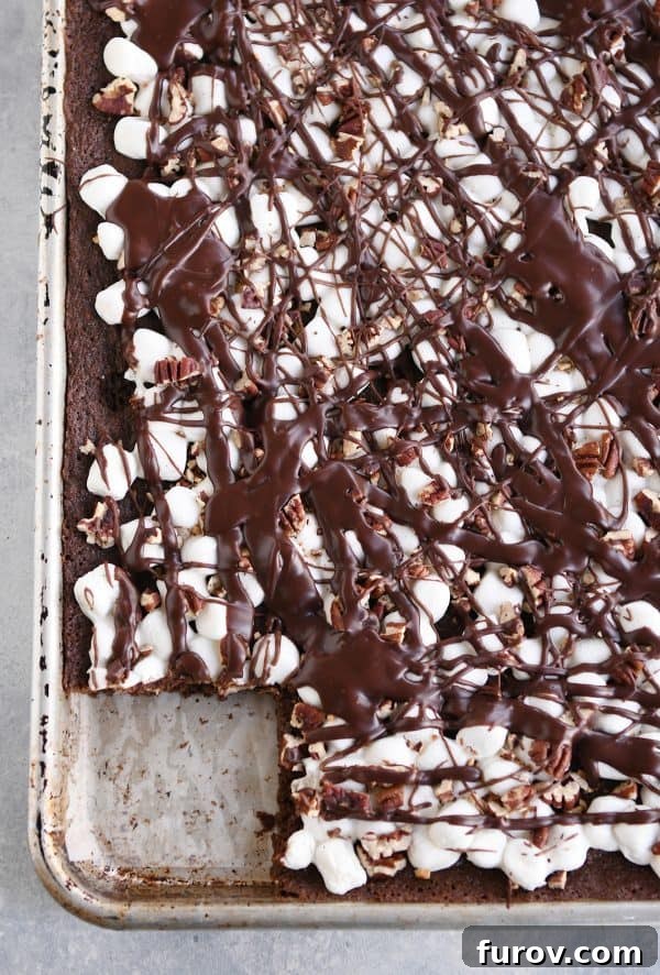 Top down view of sheet pan Mississippi Mud Bars with a bar cut out and removed.