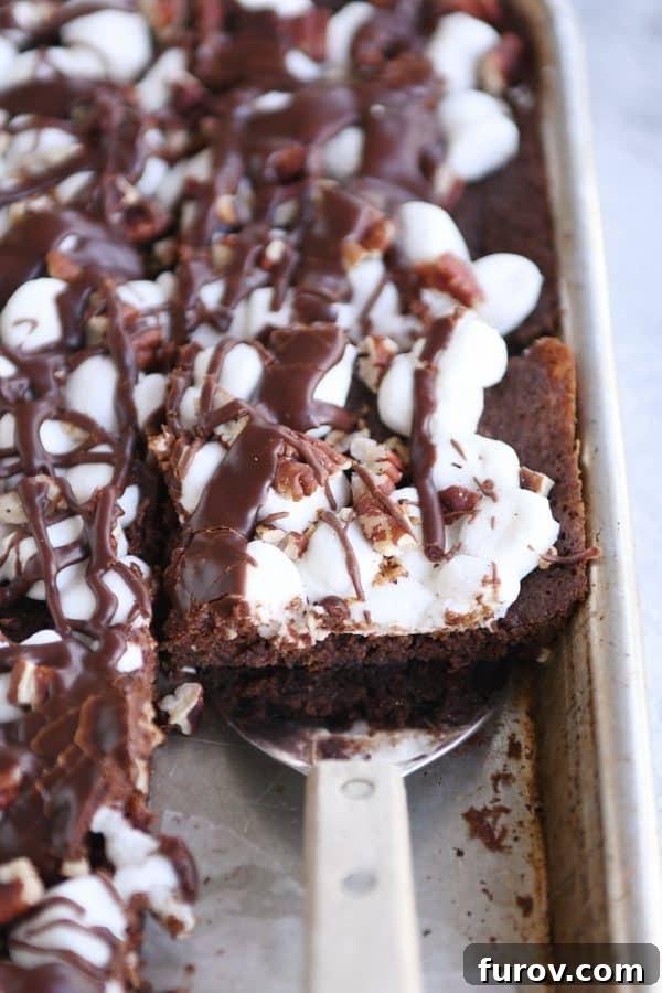Spatula removing Mississippi Mud Bars from sheet pan.