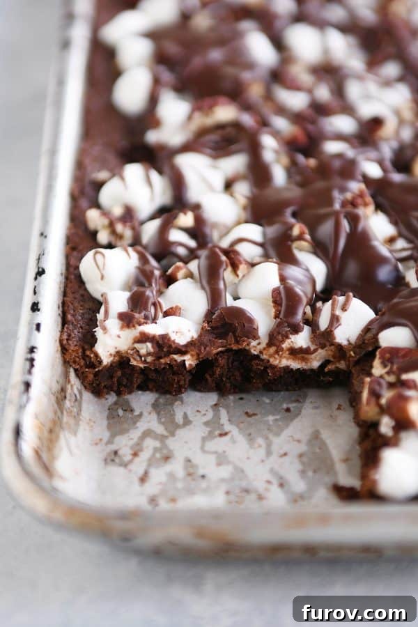 Sheet pan Mississippi Mud Bars with a bar cut out and removed.