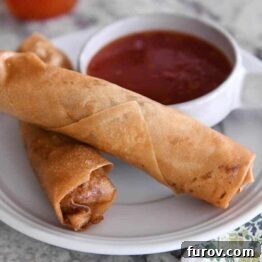 Marys Signature Egg Rolls 9 A platter of authentic, crispy egg rolls ready to be enjoyed, showcasing their golden-brown perfection.