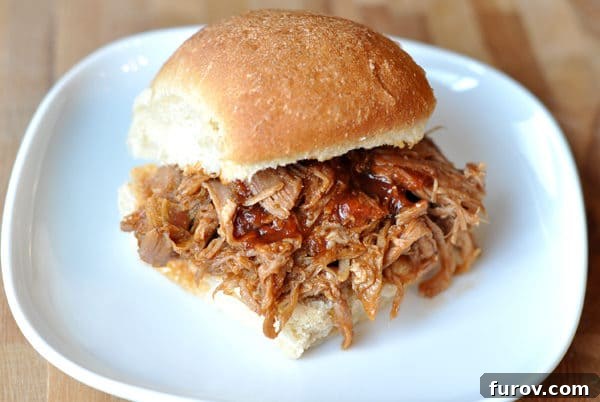BBQ Pulled Pork Sandwiches, piled high with tender pork, on soft buns.