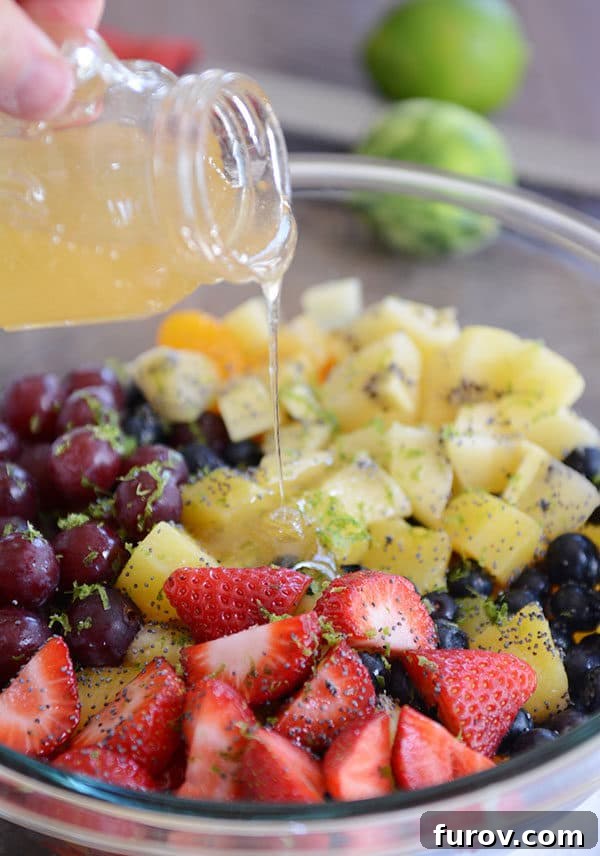 Honey Lime Fruit Salad, vibrant and fresh, in a large serving bowl.