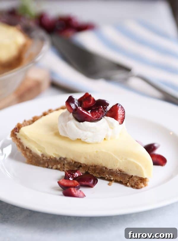 Berry Bliss Cream Pie with Toasted Pecan Graham Crust 4 Berries and cream pie with cherries on top.