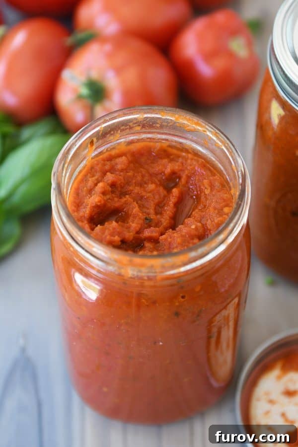 Homemade canned spaghetti sauce in quart jar.