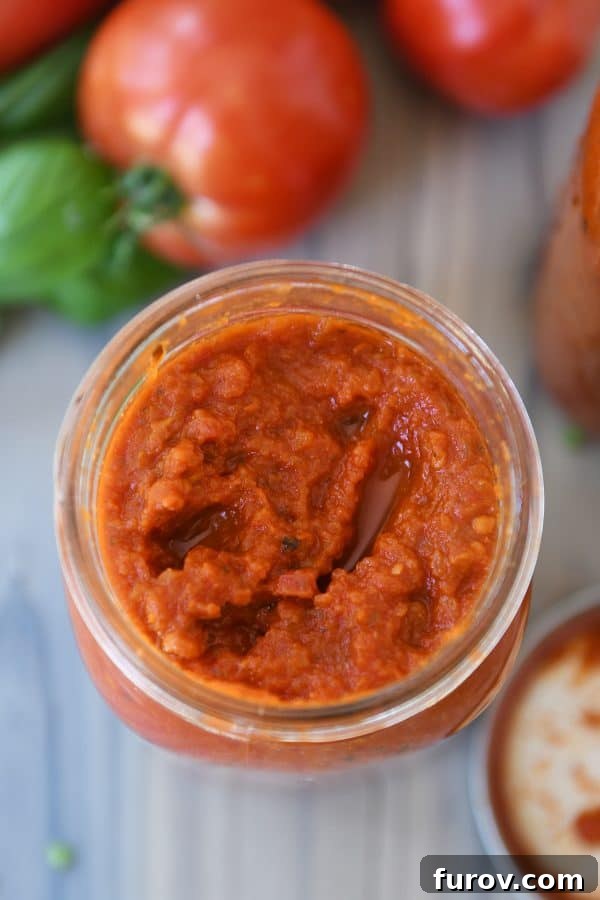 Homemade canned spaghetti sauce in quart jar.