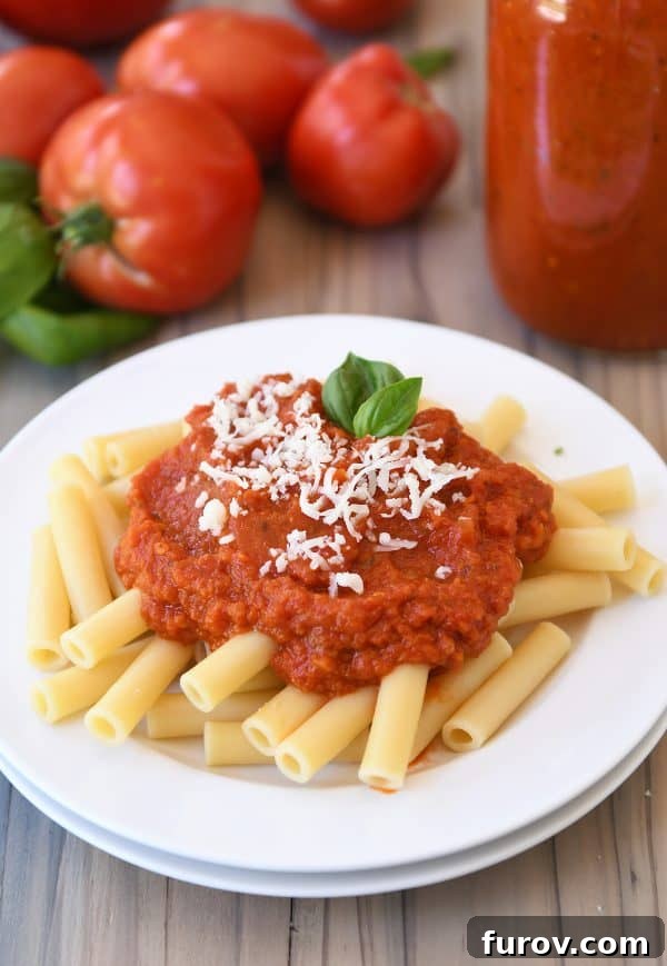 Homemade canned spaghetti sauce recipe with penne pasta.