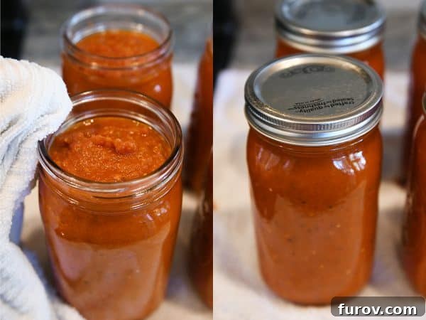 Wiping edge of jar and putting on lids and rings for homemade canned spaghetti sauce recipe.