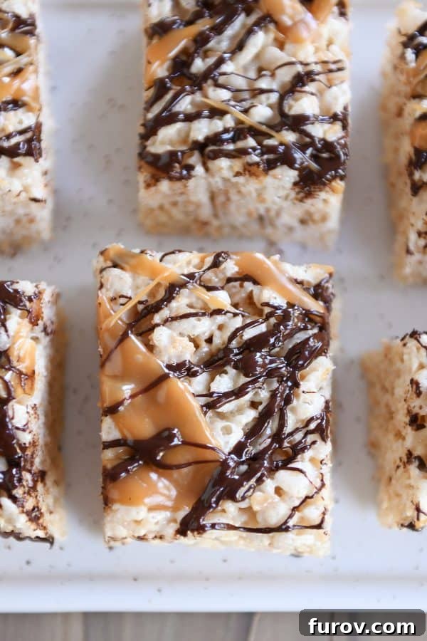 Toasted Coconut Caramel Crunch Bars 3 Top down view of Toasted Coconut Caramel Rice Krispie Treats on parchment paper.