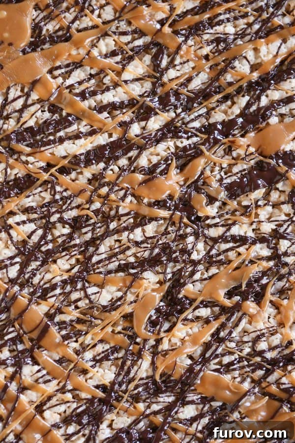 Toasted Coconut Caramel Crunch Bars 4 Top down view of Toasted Coconut Caramel Rice Krispie Treats on parchment paper.