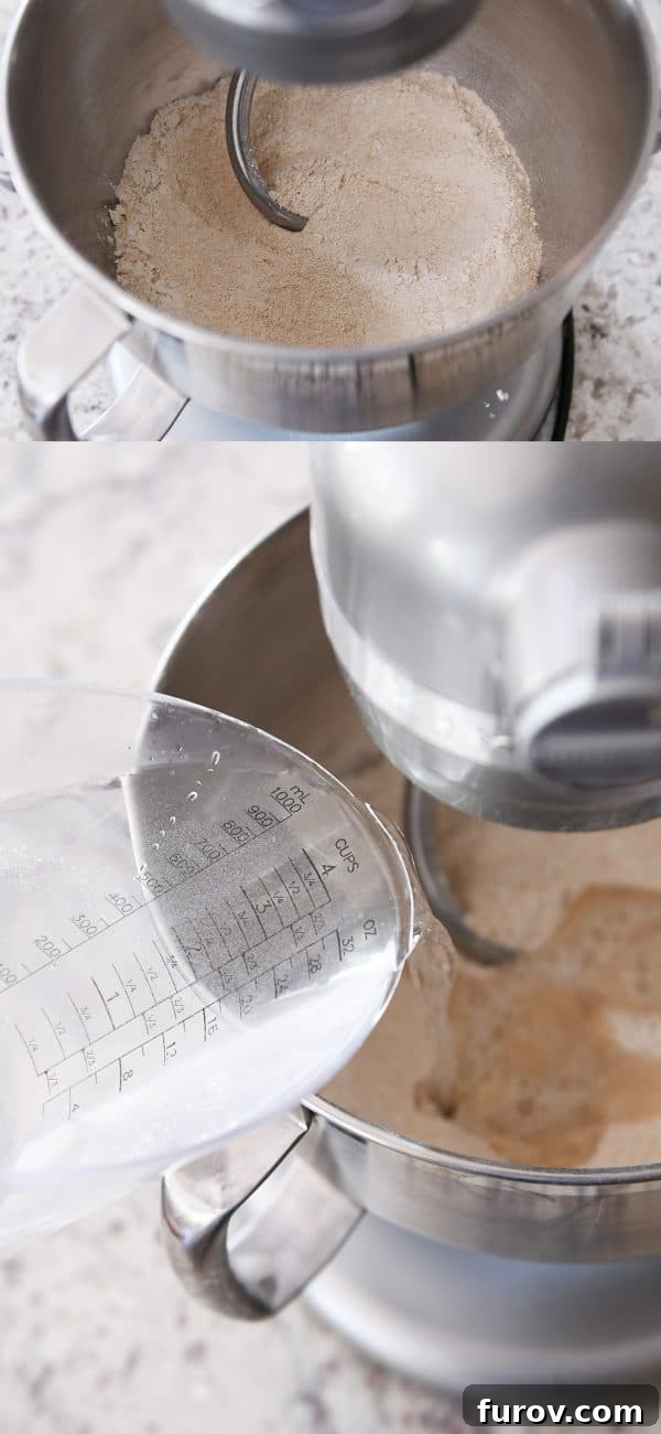 KitchenAid Small Batch Soft Fluffy Whole Wheat Bread Recipe 5 Warm water being added to the flour and yeast mixture in a KitchenAid bowl.