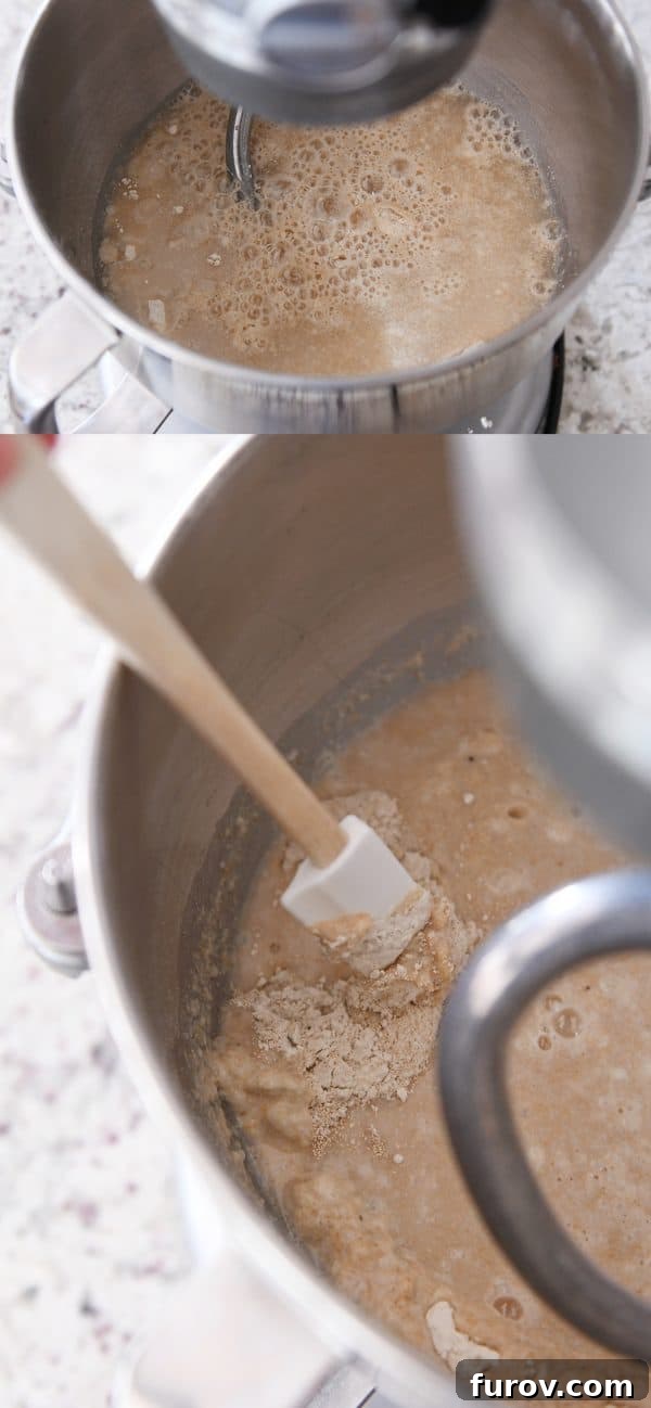 KitchenAid Small Batch Soft Fluffy Whole Wheat Bread Recipe 6 Water and yeast mixing with whole wheat flour in a KitchenAid bowl, forming a wet sponge.