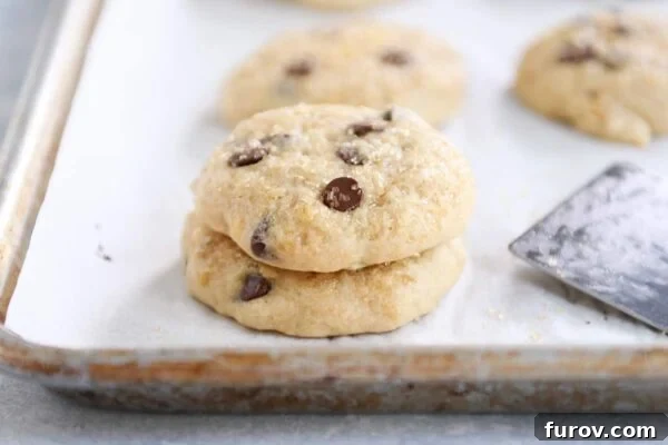 Pillowy Banana Bread Cookies 6 A beautiful stack of five soft banana bread cookies on a crisp white napkin, ready to be enjoyed.