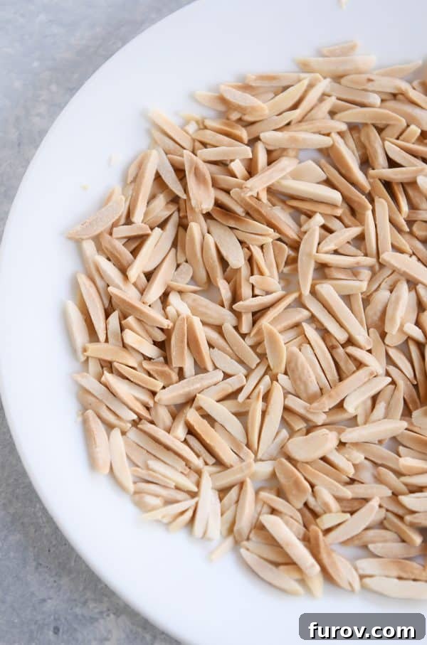 Get Perfectly Toasted Nuts in Your Microwave 4 How to toast nuts in the microwave; toasted nuts on white plate.