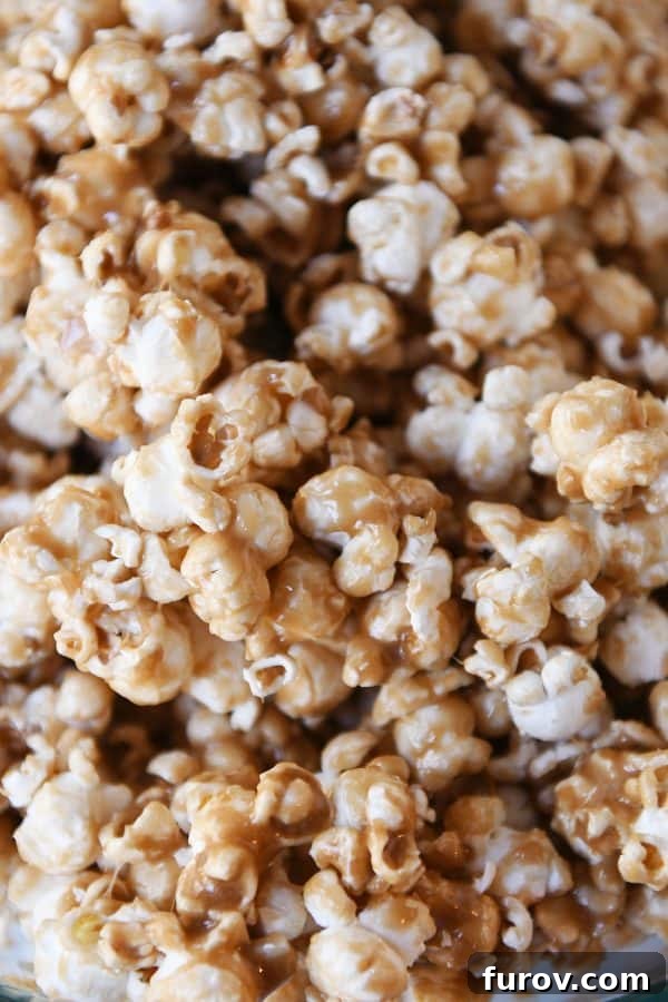Irresistibly Soft Chewy Caramel Popcorn 3 Closeup of soft and chewy caramel popcorn, showcasing its luscious texture.