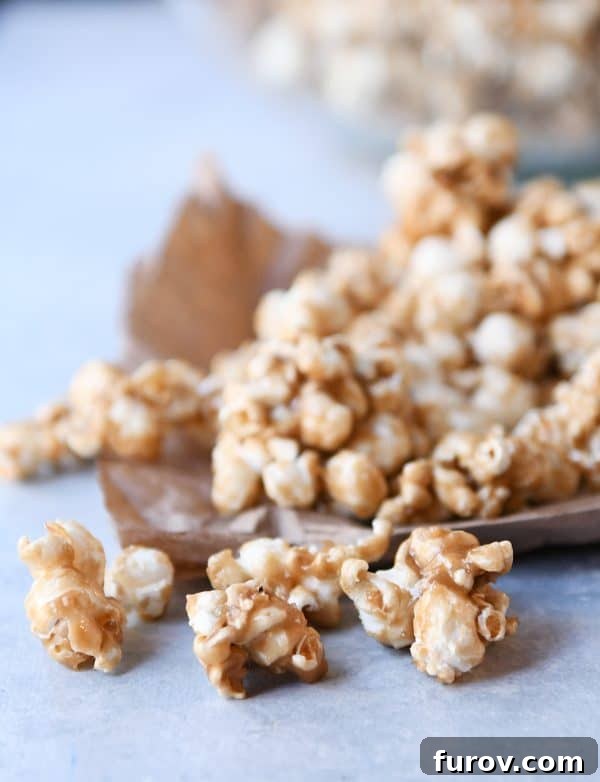 Irresistibly Soft Chewy Caramel Popcorn 5 Soft and chewy caramel popcorn on brown paper bag, ready for a cozy treat.